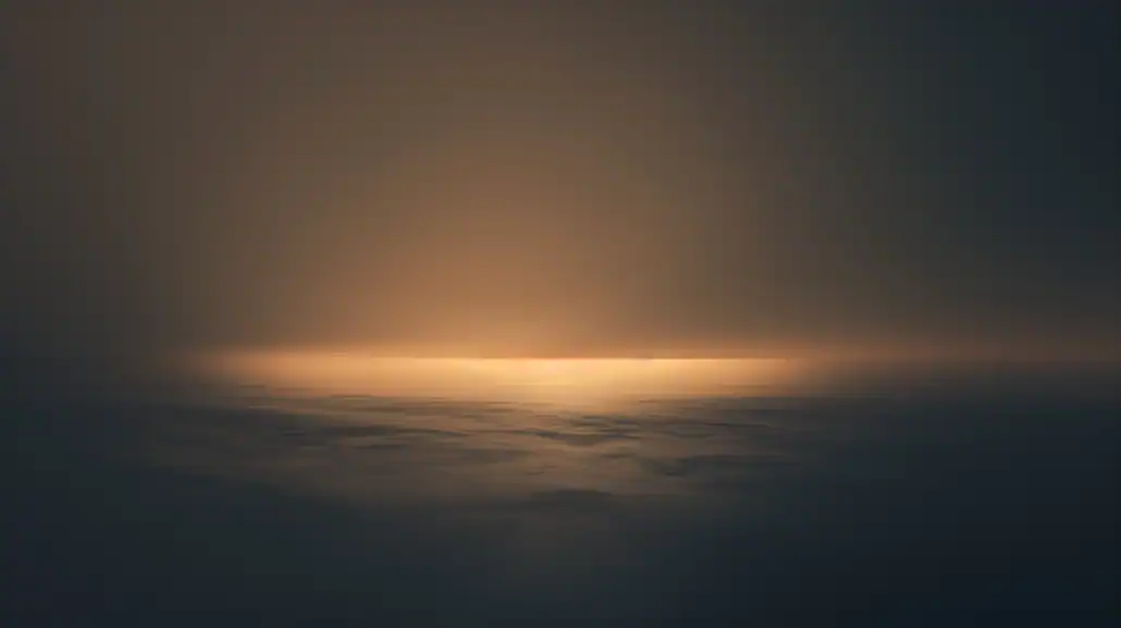 Gentle calm warm light emerging from the horizon.