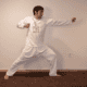 Yoga Master Anmol Mehta demonstrating Kundalini Yoga Archer Pose
