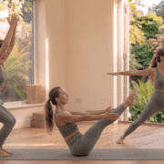 Beginner performing a 10 minute full body yoga workout at home with chair pose, warrior II and boat pose